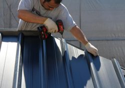a man installing a gazebo roof