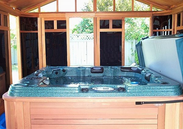 view of gazebo from inside with hot tub