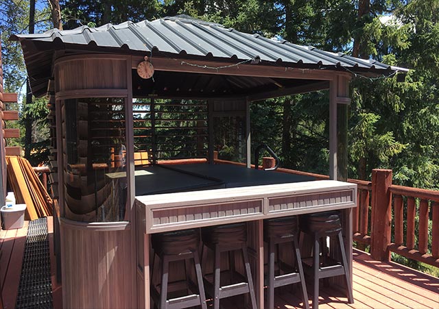 a gazebo with bar and stools