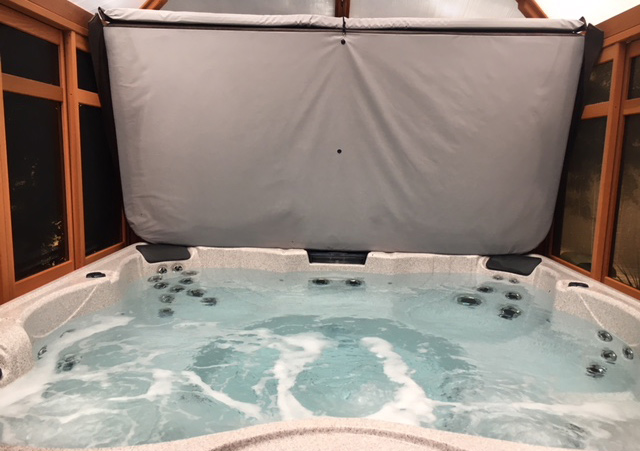 a hot tub inside a gazebo